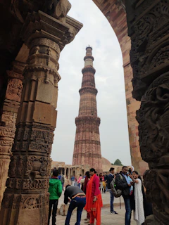 A group photo of association members gathered around a heritage monument.