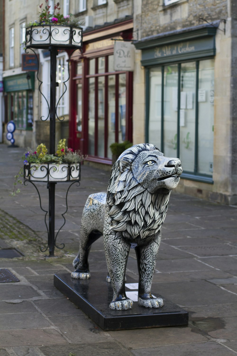 lion statue near commercial building