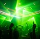 people dancing inside room with green lights