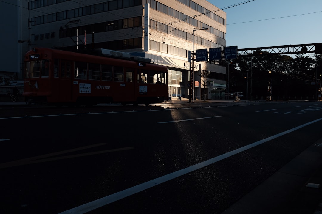 tram passes near building