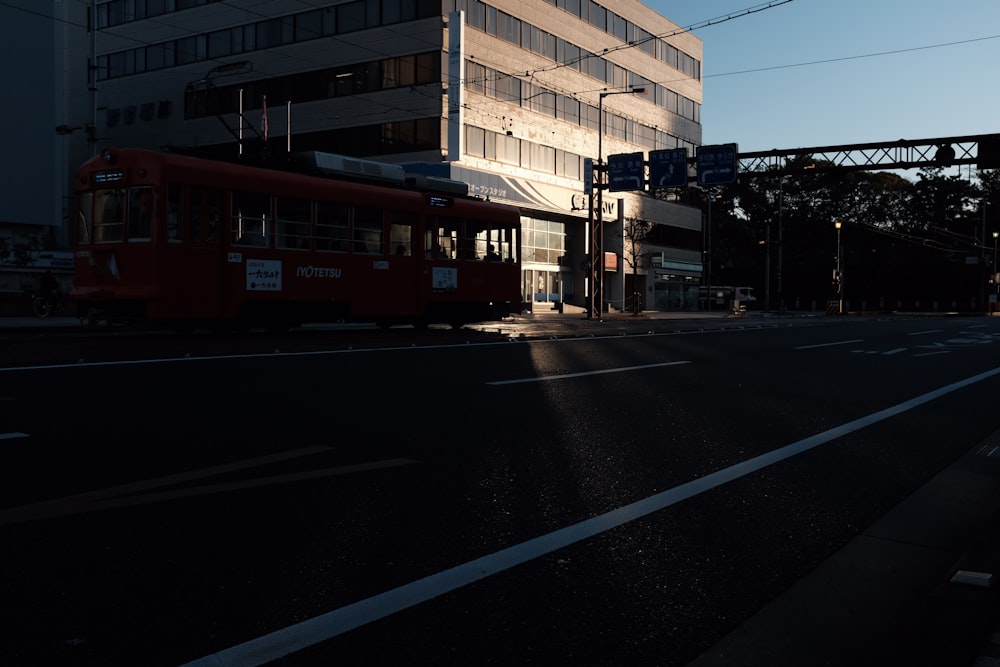 tram passes near building