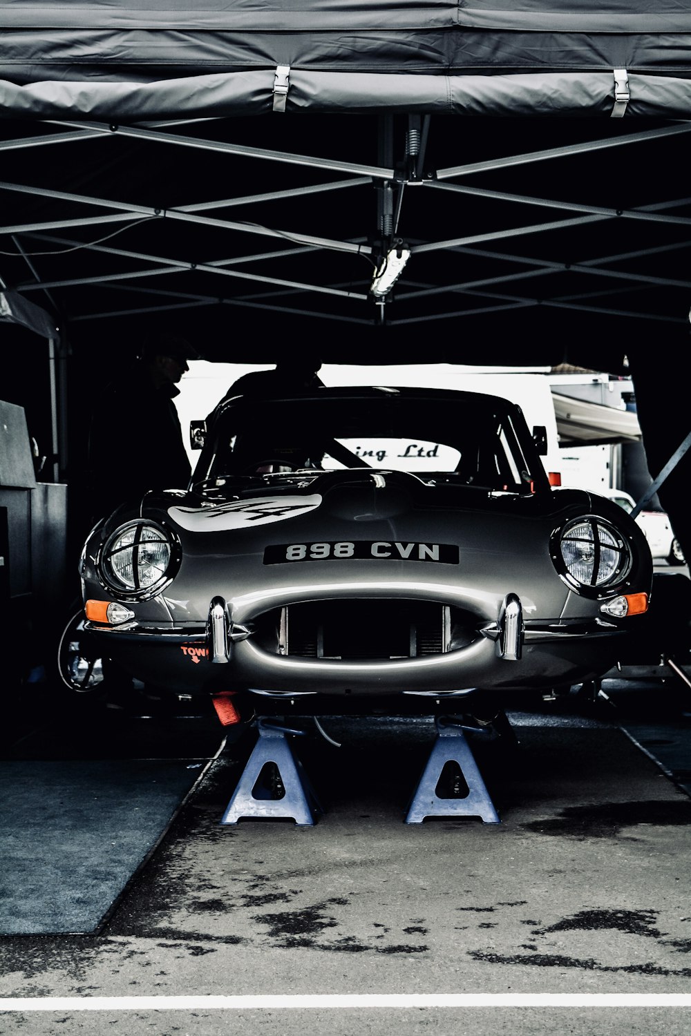 man fixes Alpine 110 car