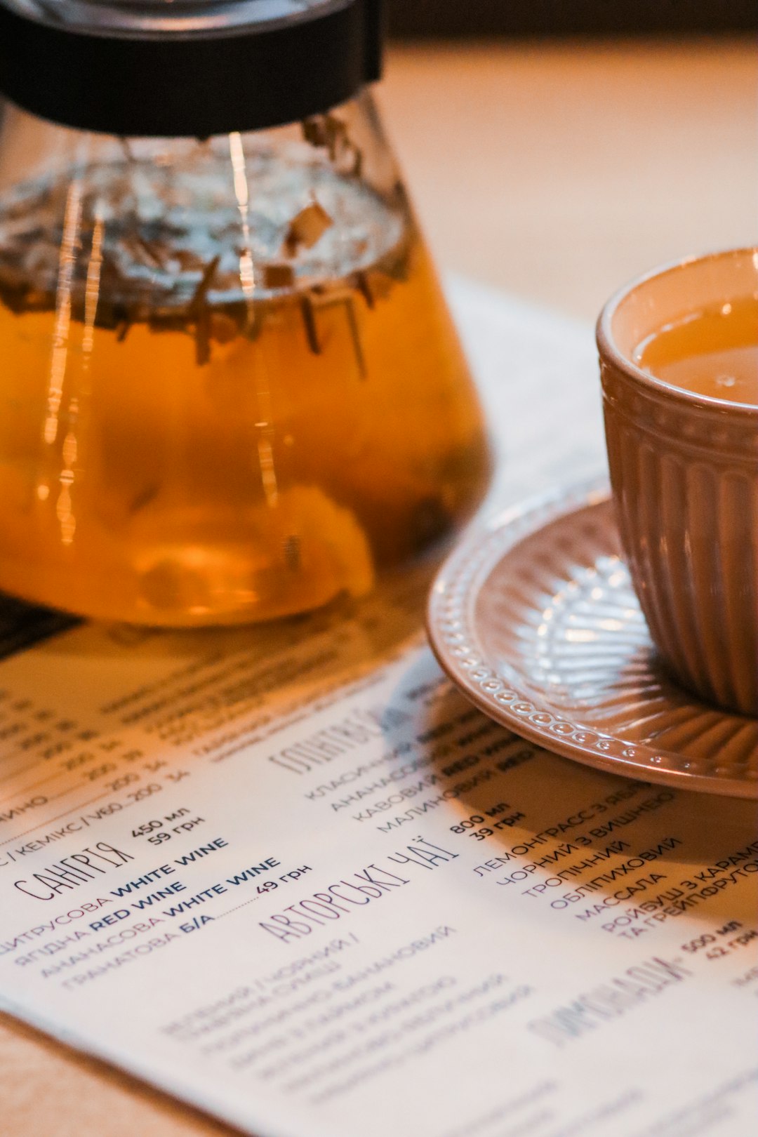 menu under cup of coffee