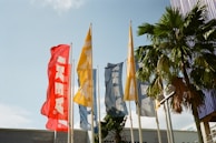 An outdoor scene featuring colorful flags fluttering in the wind.