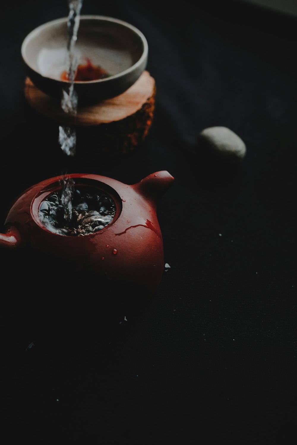 red pot beside bowl