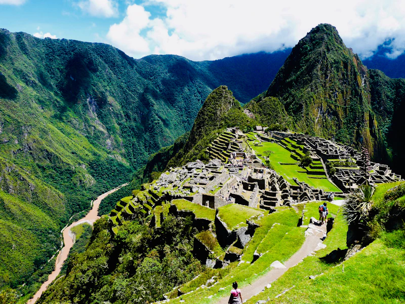 Aerial view of Machu Picchu Pueblo town set among forested Andean mountains