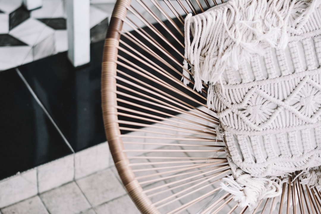 gray fringe knit apparel on brown basket