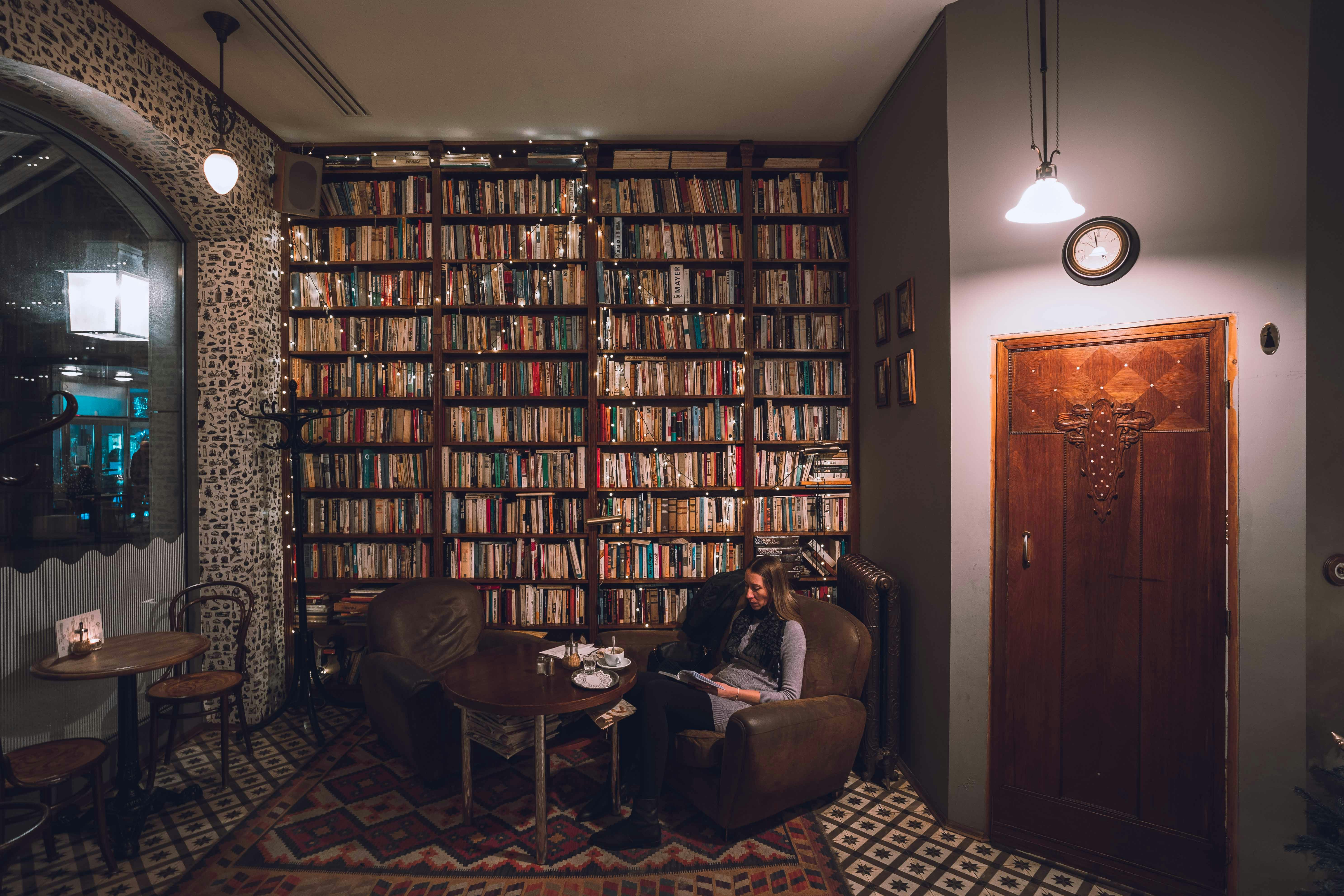 woman sitting on brown sofa chair