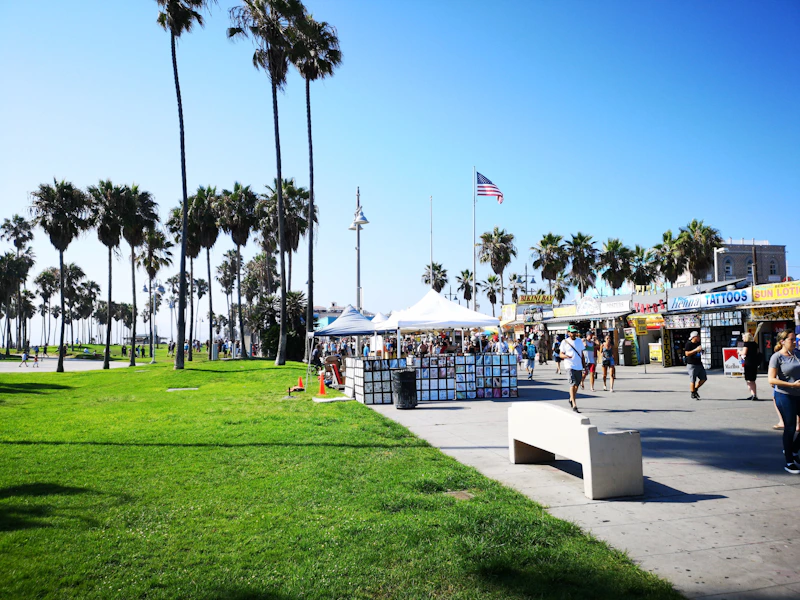 Busy outdoor market with vendors and shoppers