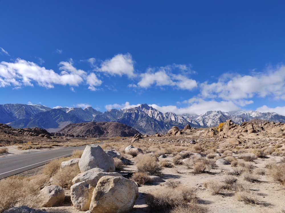 road beside rocky mountain