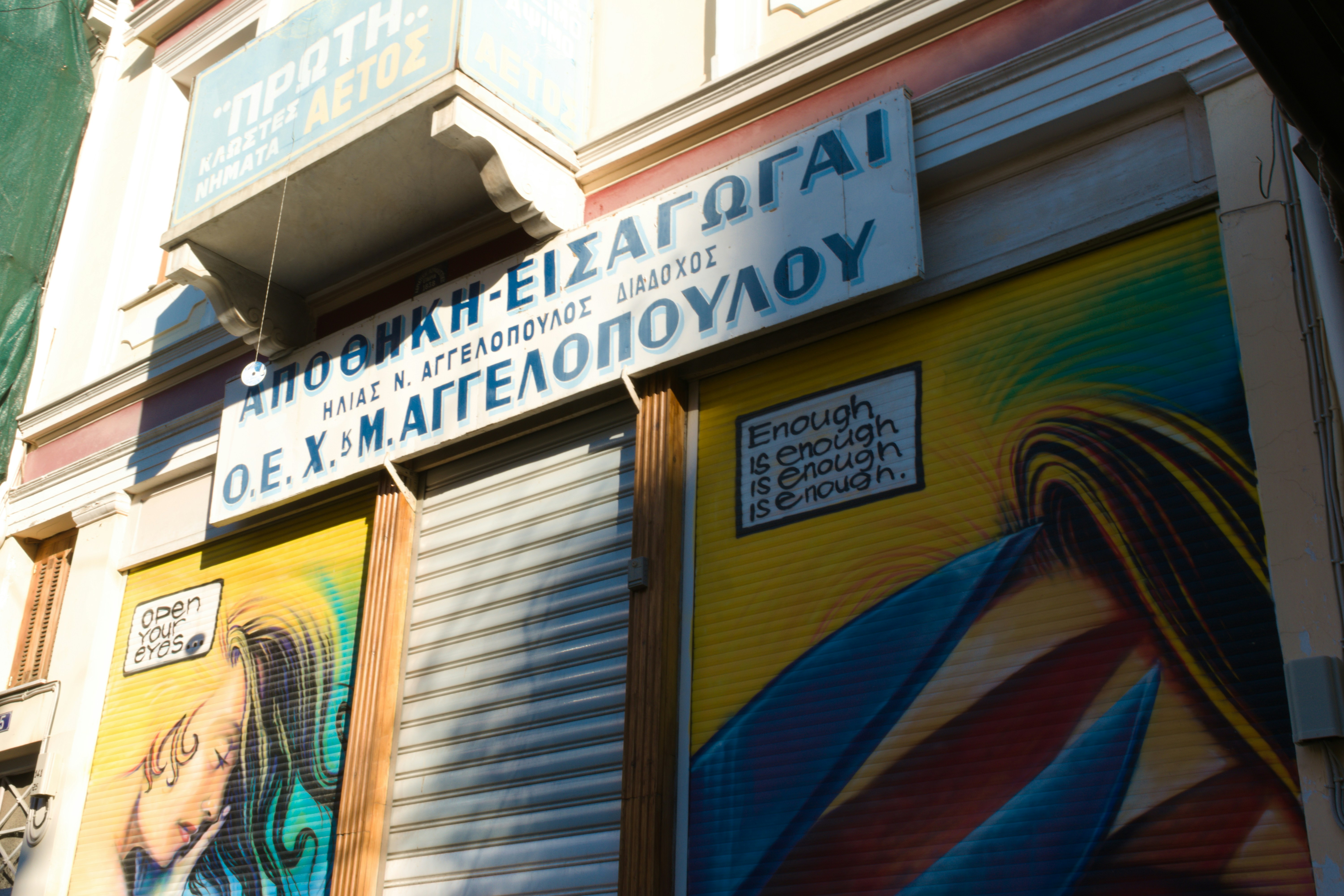 Athens Shop with Graffiti on a sunny day! 