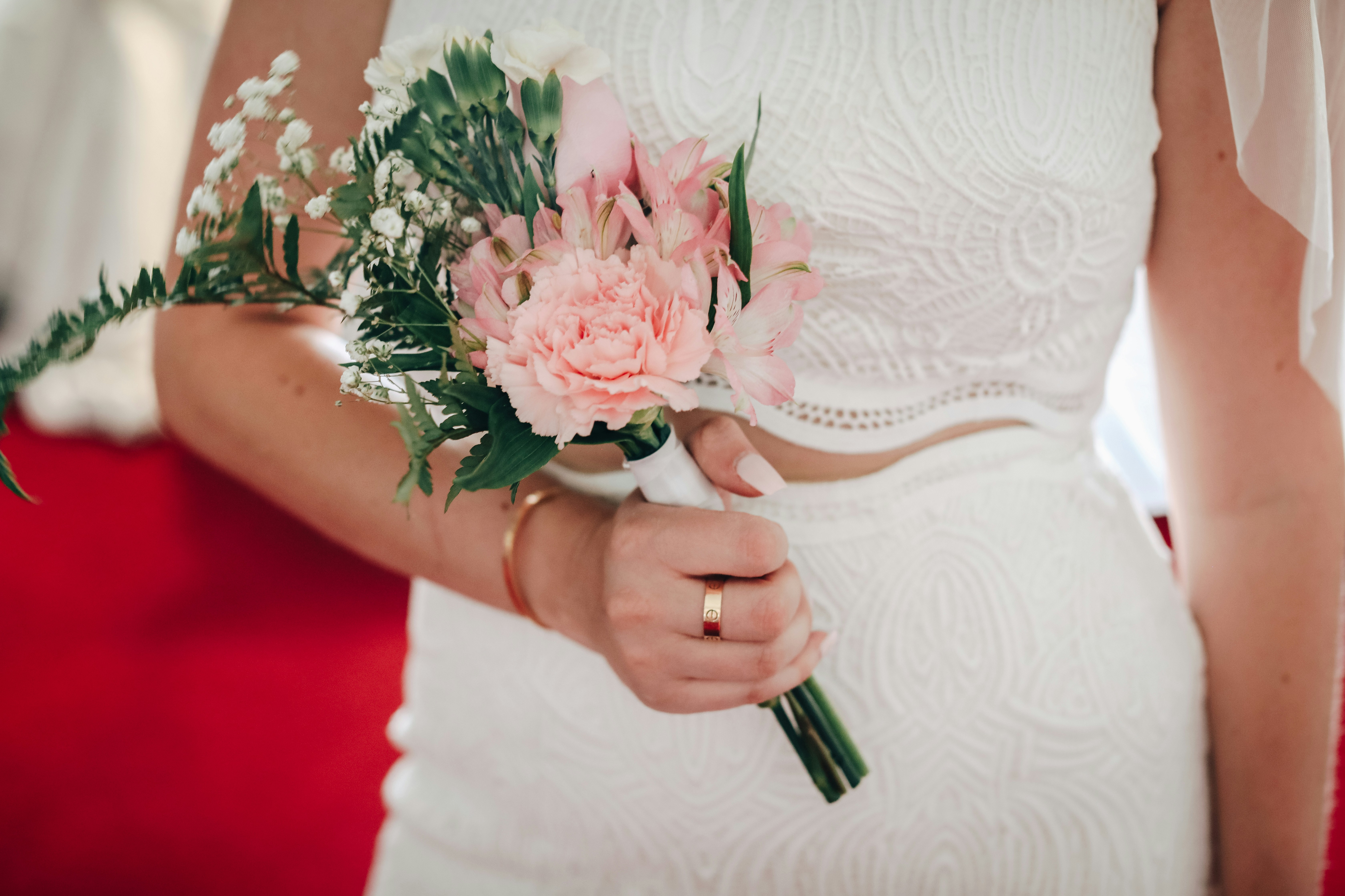 Bride with her bouquet of flowers & Cartier jewelry at a Little White Chapel in Las Vegas.