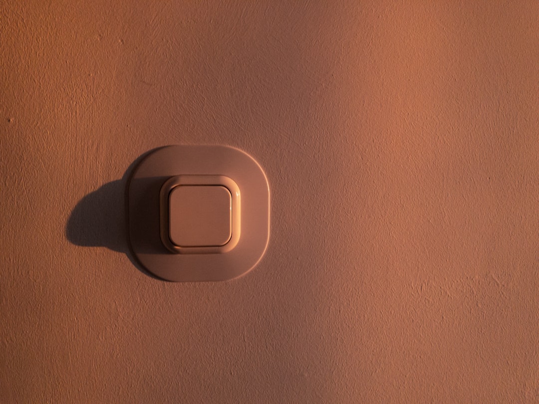 white button on wall