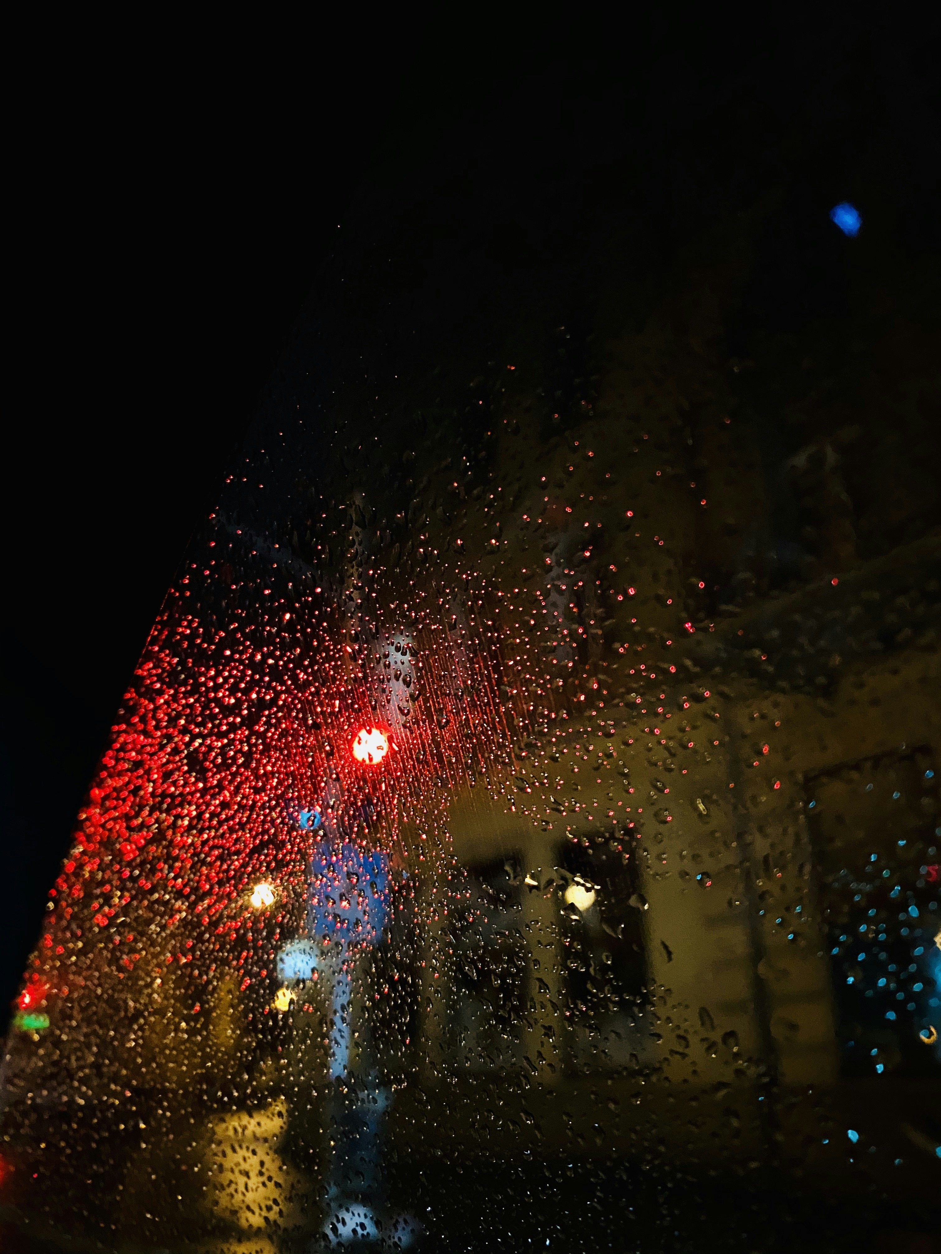 Rain drops on the window of a car at night photo – Free Light Image on ...