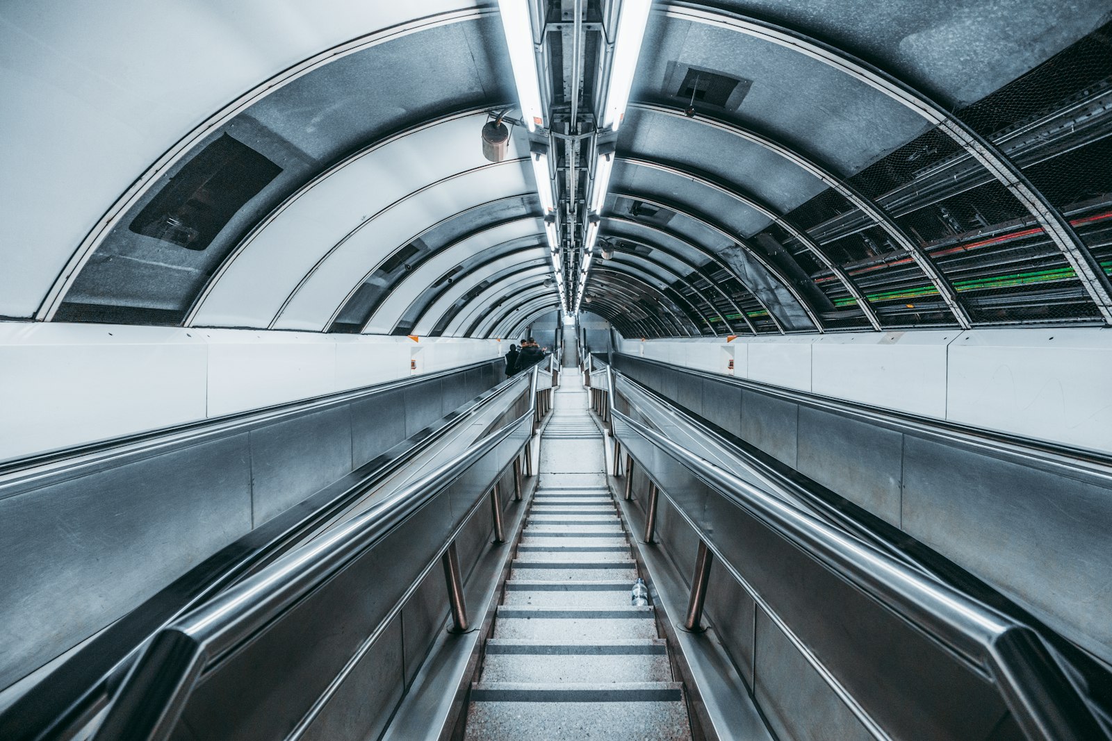 Sony a6000 + ZEISS Touit 12mm F2.8 sample photo. Gray escalator photography