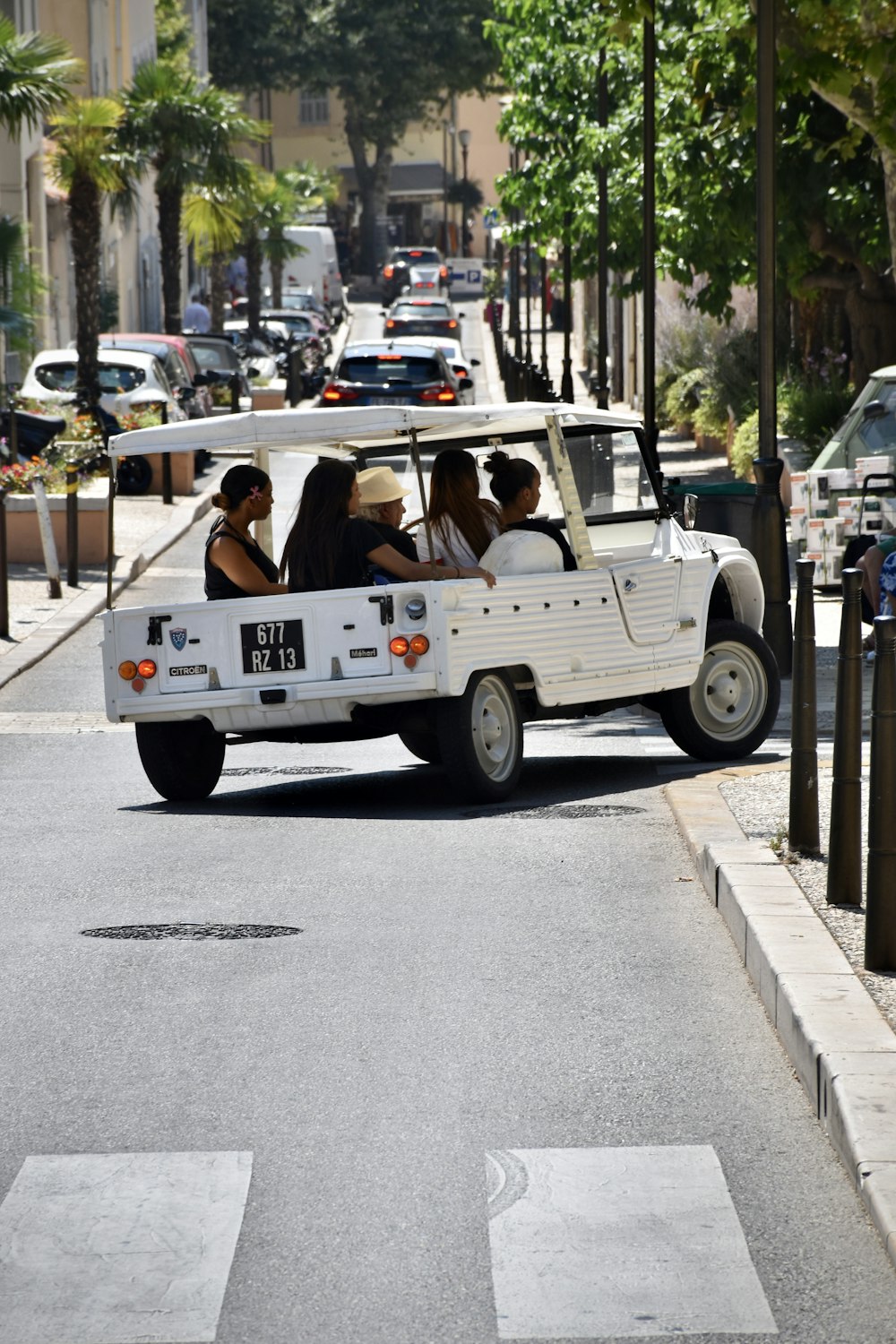 people riding white SUV during daytime