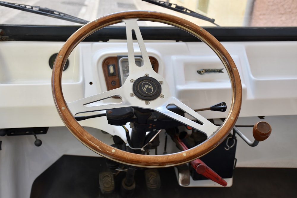 selective focus photography of white and brown steering wheel