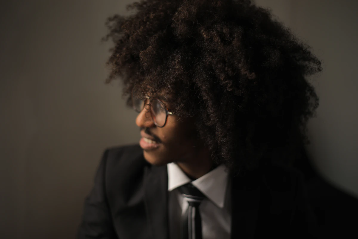 Smiling man in black suit