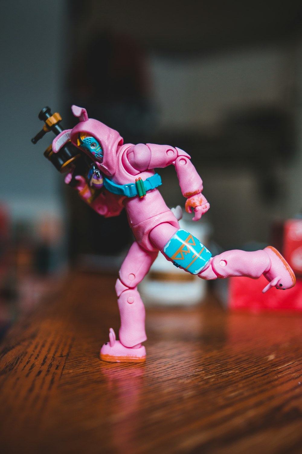 person pink and green armored suit action figure