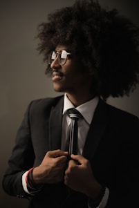 selective focus photography of man in black suit