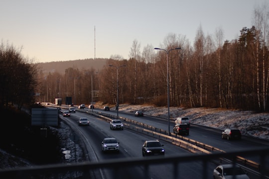 photography of vehicle traveling on road during daytime in Jyväskylä Finland