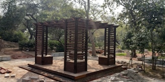 A sturdy wooden pergola built in a garden, showcasing clean lines and craftsmanship.