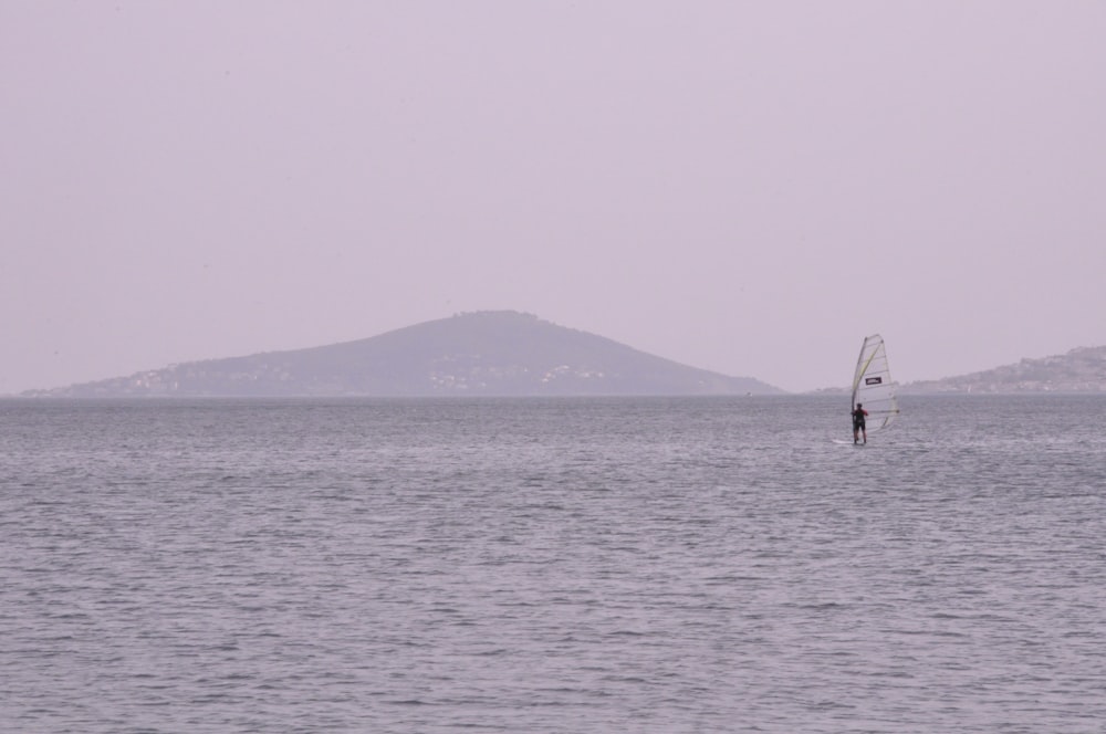 person surfing on sea