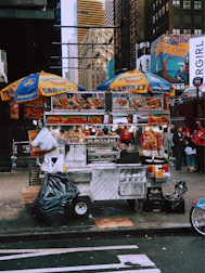 Stacks of Sabrett hotdog packages displayed in a local grocery store.