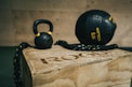 black metal kettle bell and heavy bag