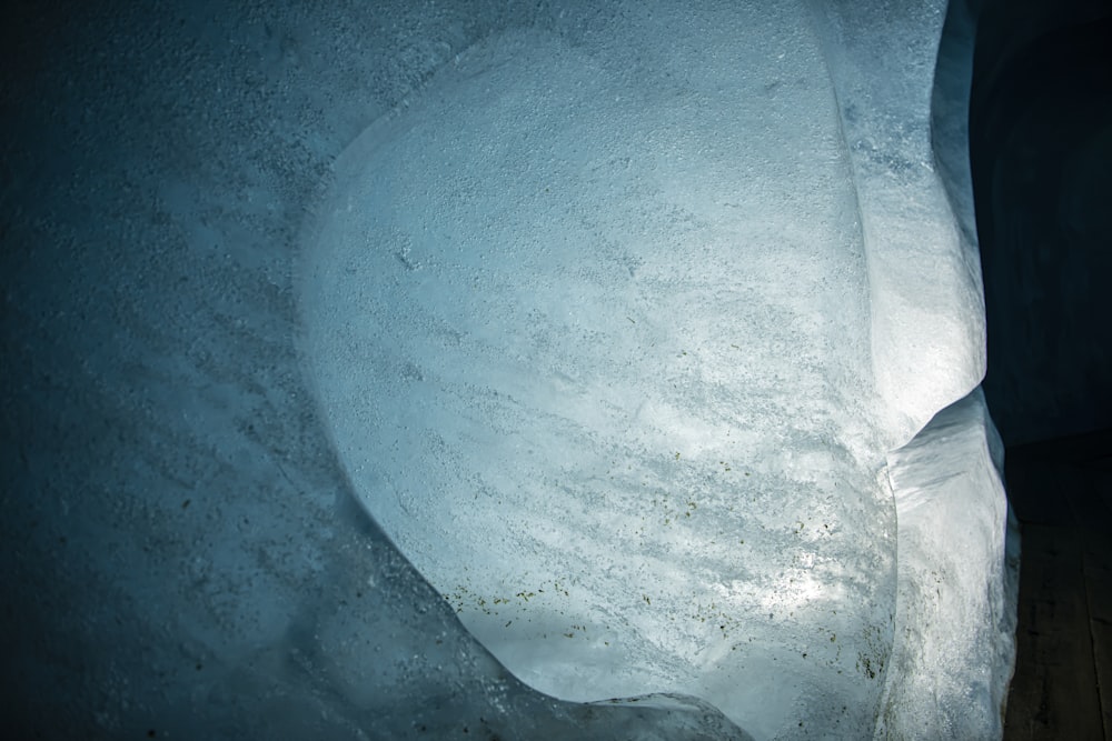 an ice cave with snow on the ground