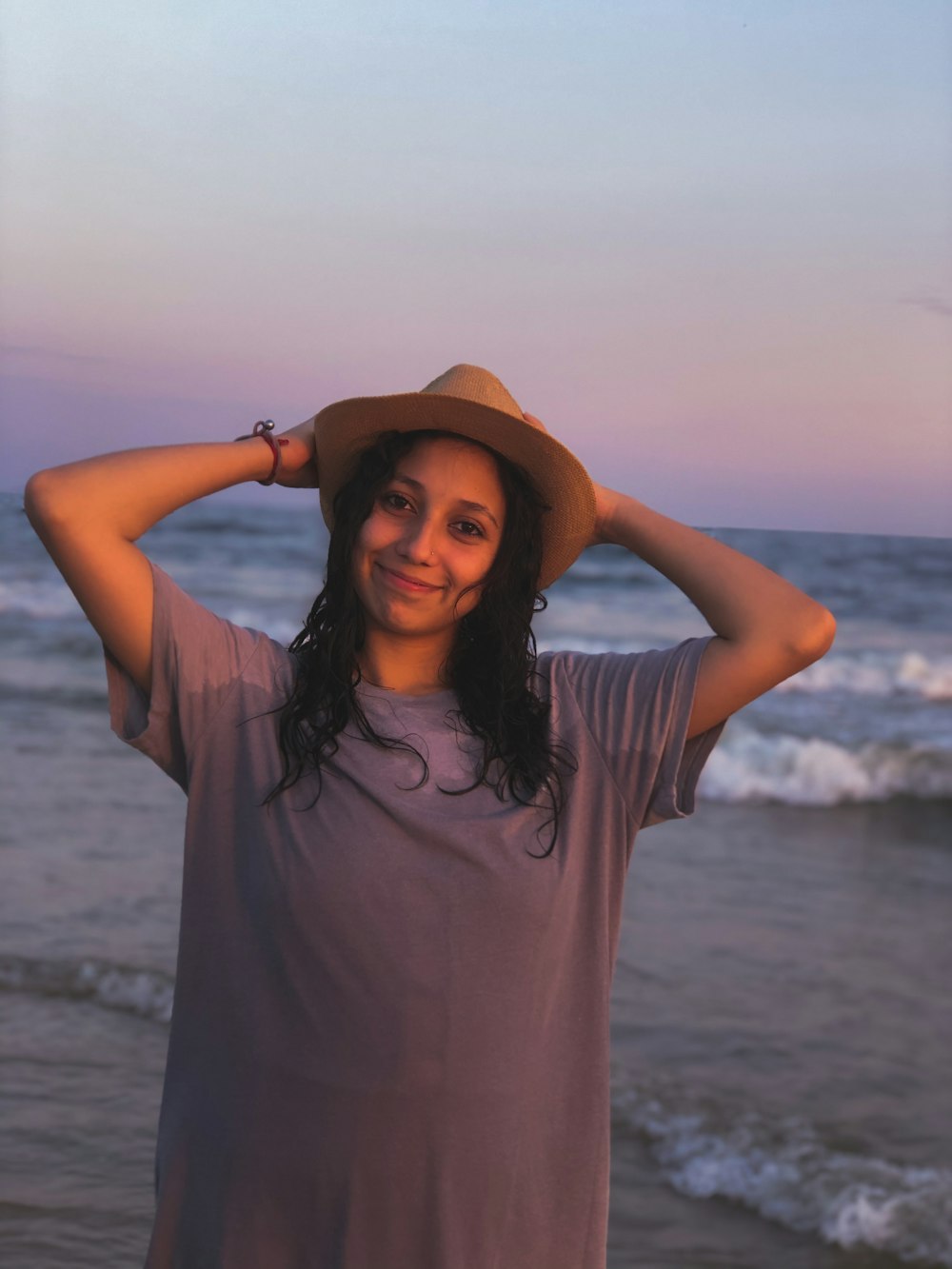 woman in gray shirt at beach