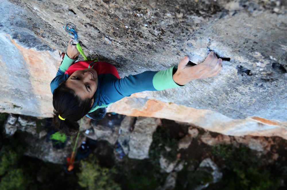 woman climbing wall