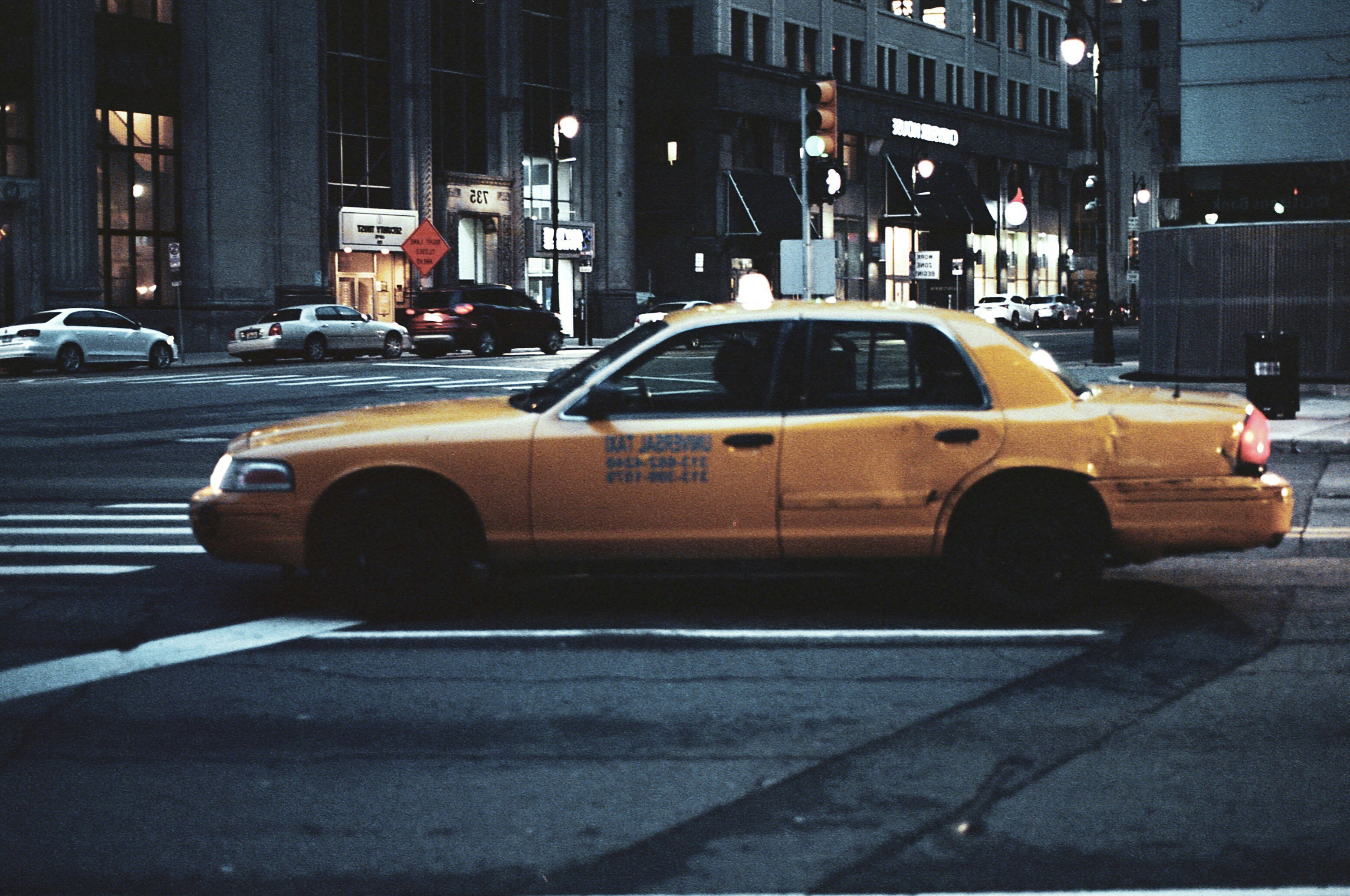 yellow taxi on road