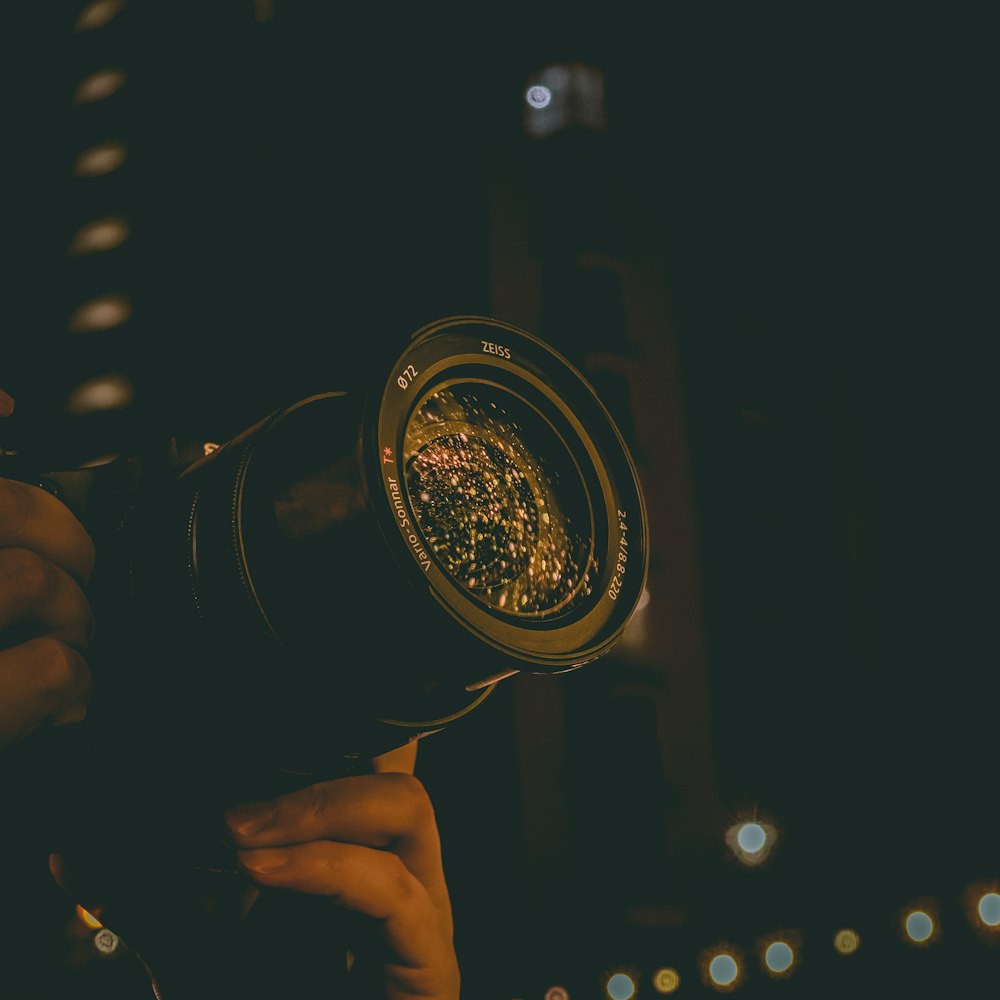 black DSLR camera with telephoto lens