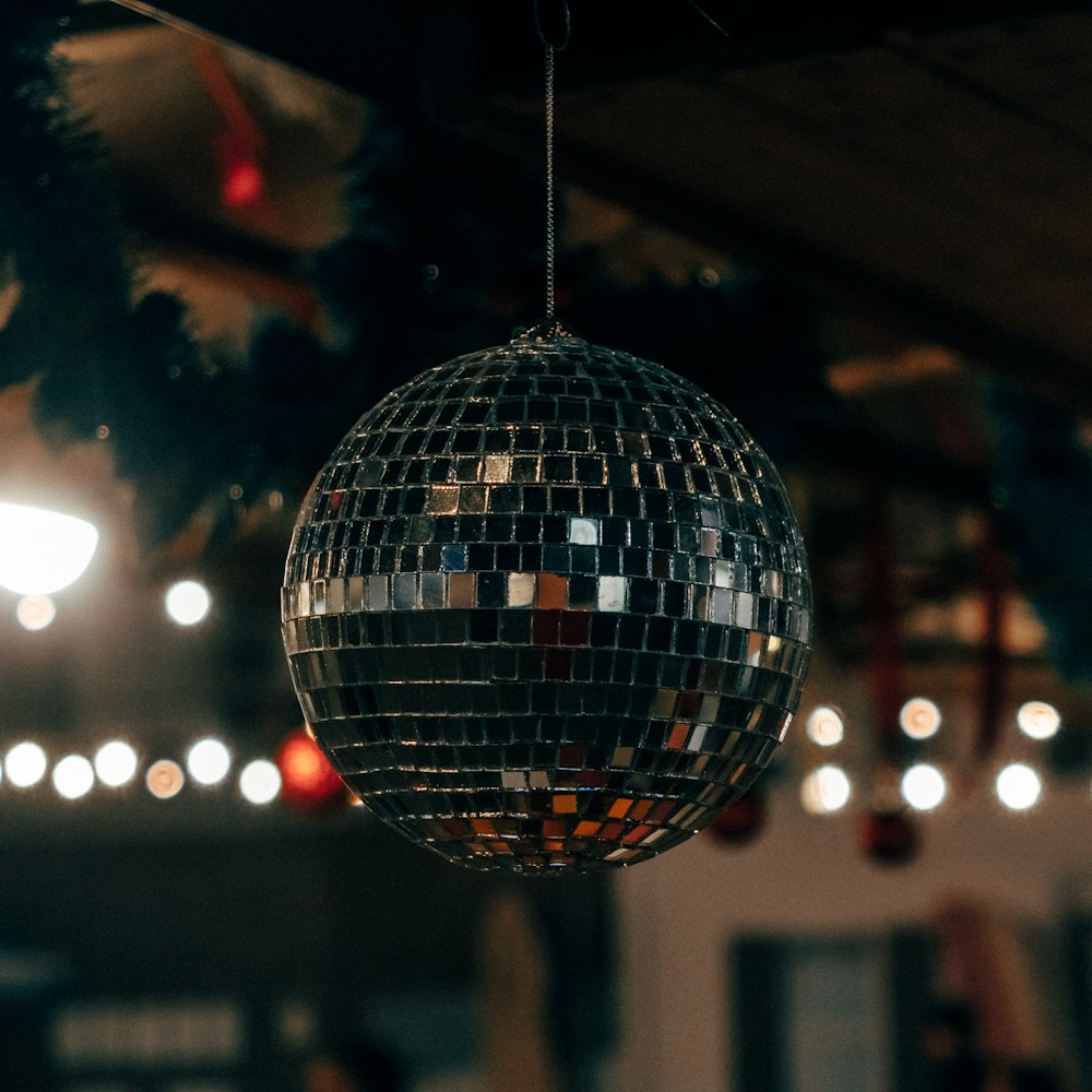 bokeh photography of silver mirror disco ball