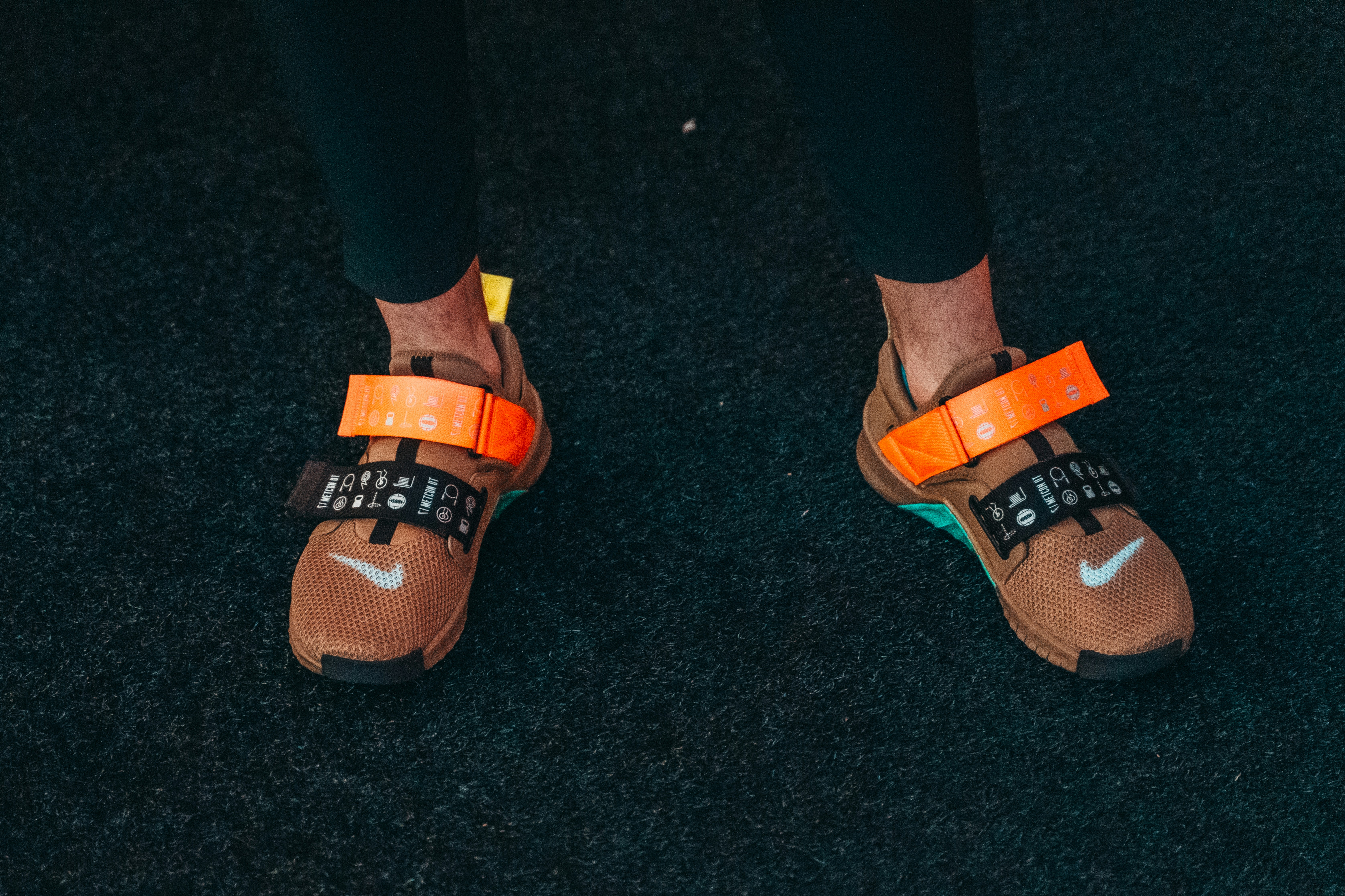 Training shoes on black turf