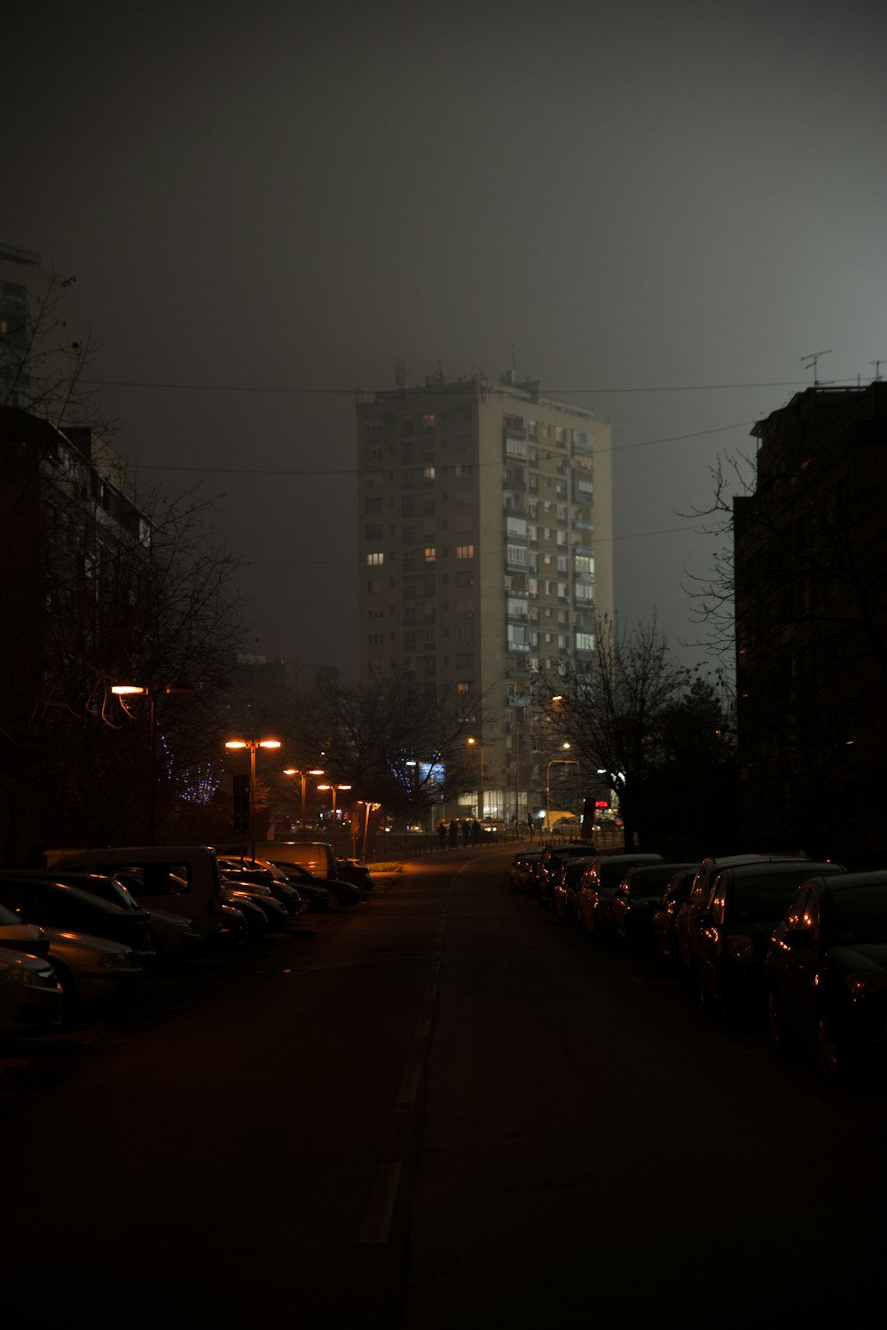 brown concrete building covered with mist