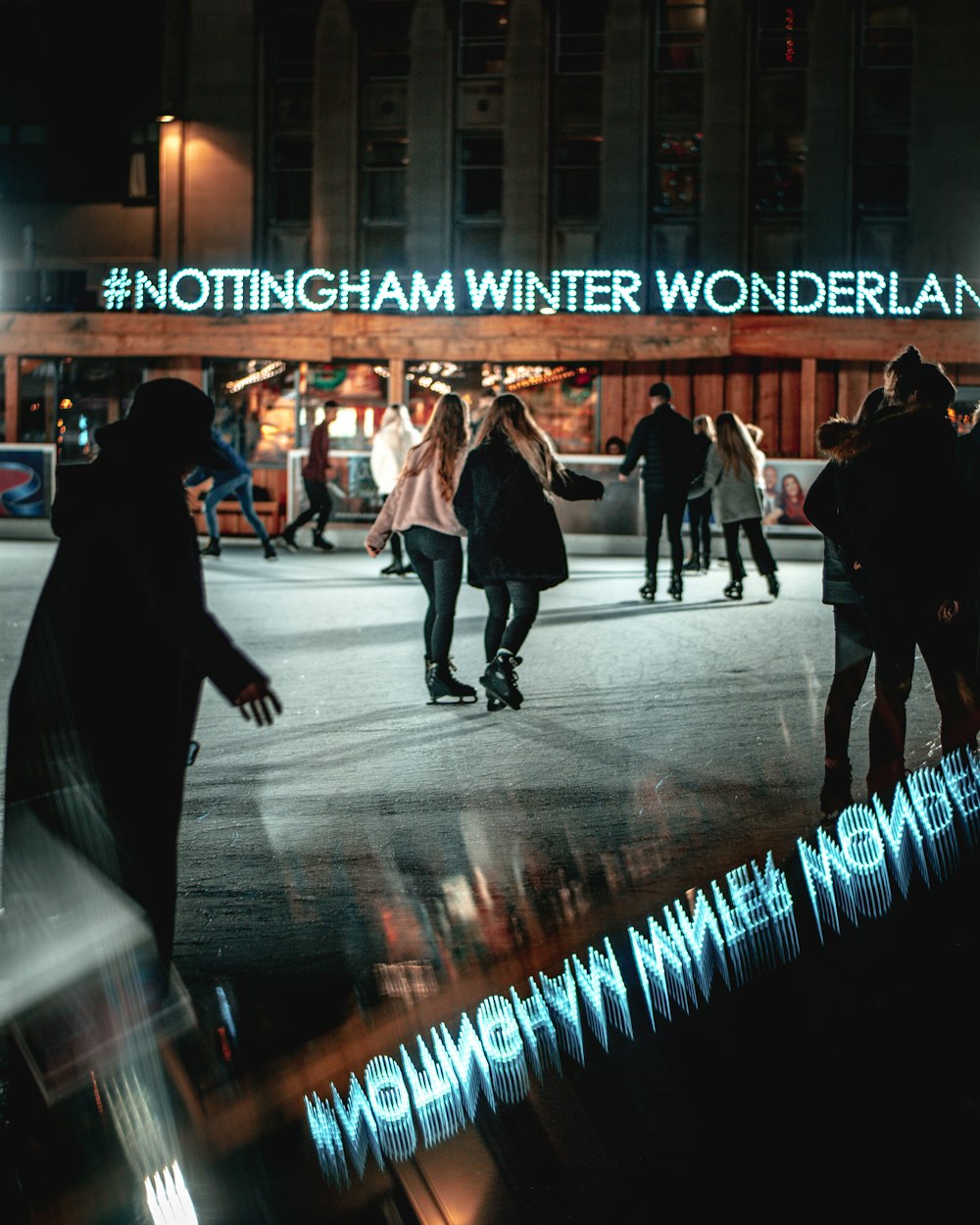 people in Notthingham Winter Wonderland ice rink