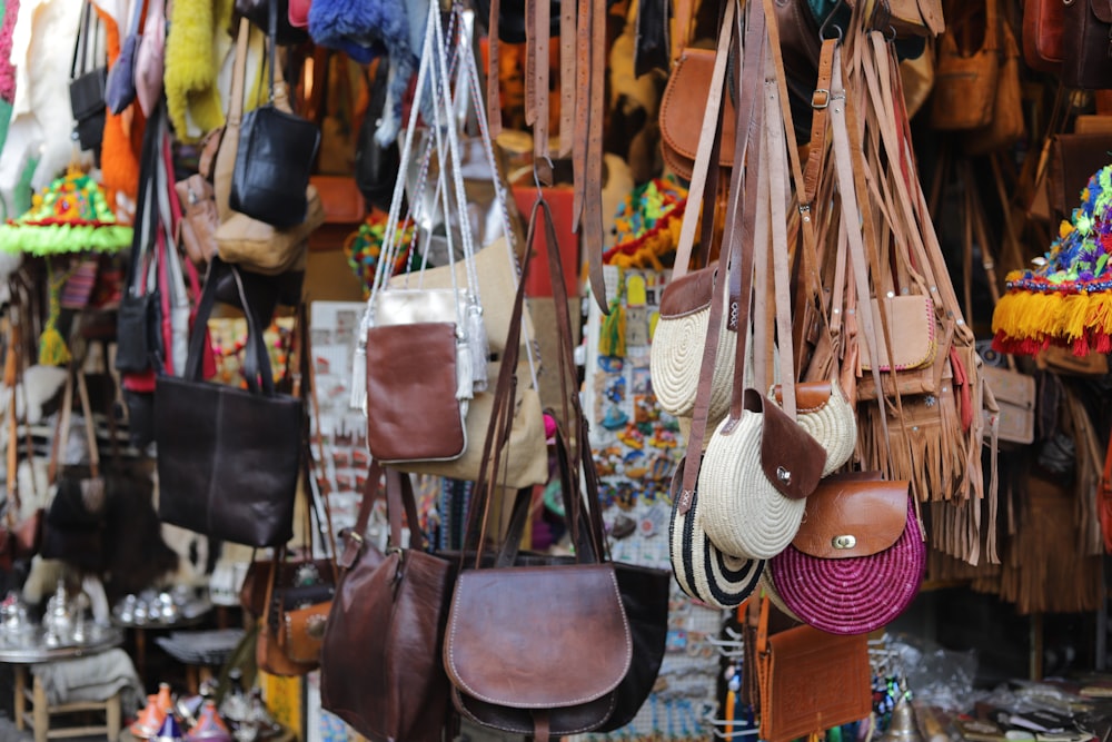 Assorted color saddle crossbody bags hanging in a store photo – Free  Accessories Image on Unsplash