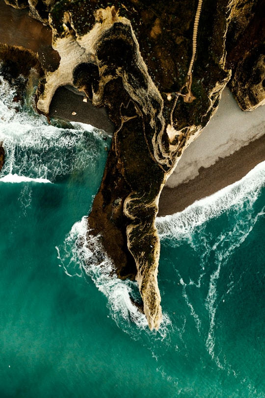 aerial photography of cliff viewing body of water during daytime in Étretat France