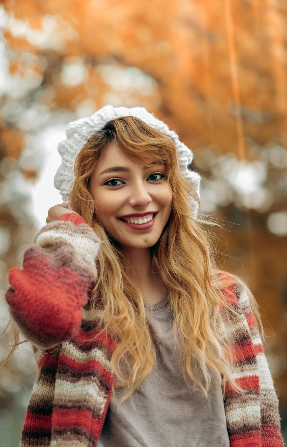 woman wearing red and white stripe jacket