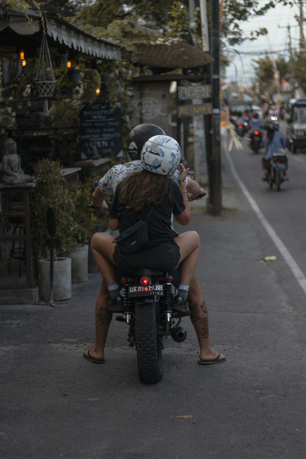 couple riding on the motorcycle
