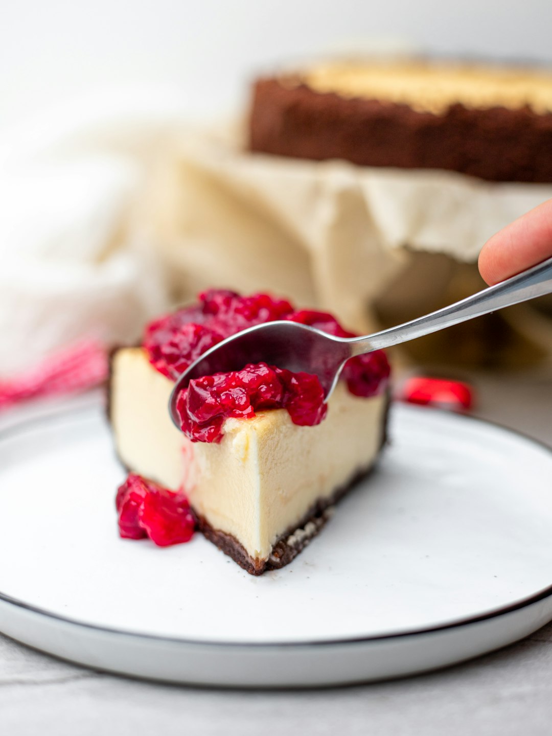 Time to indulge - New York cheesecake with a little twist. Chocolate cookie crust instead of a traditional vanilla and some sour cherry topping. 
