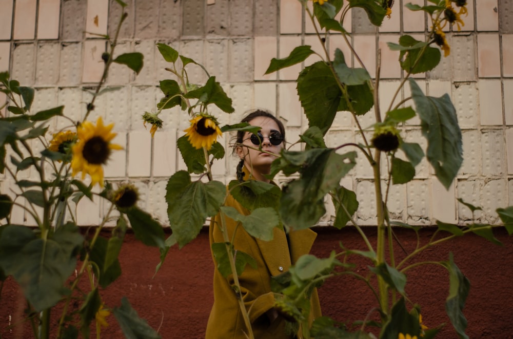 woman looking at the sunflowers