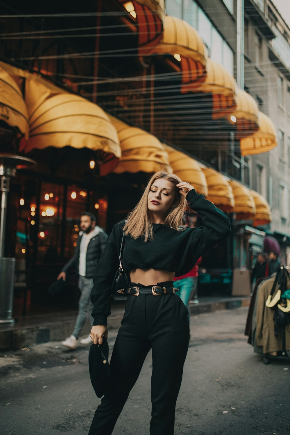 woman standing near people and building during day