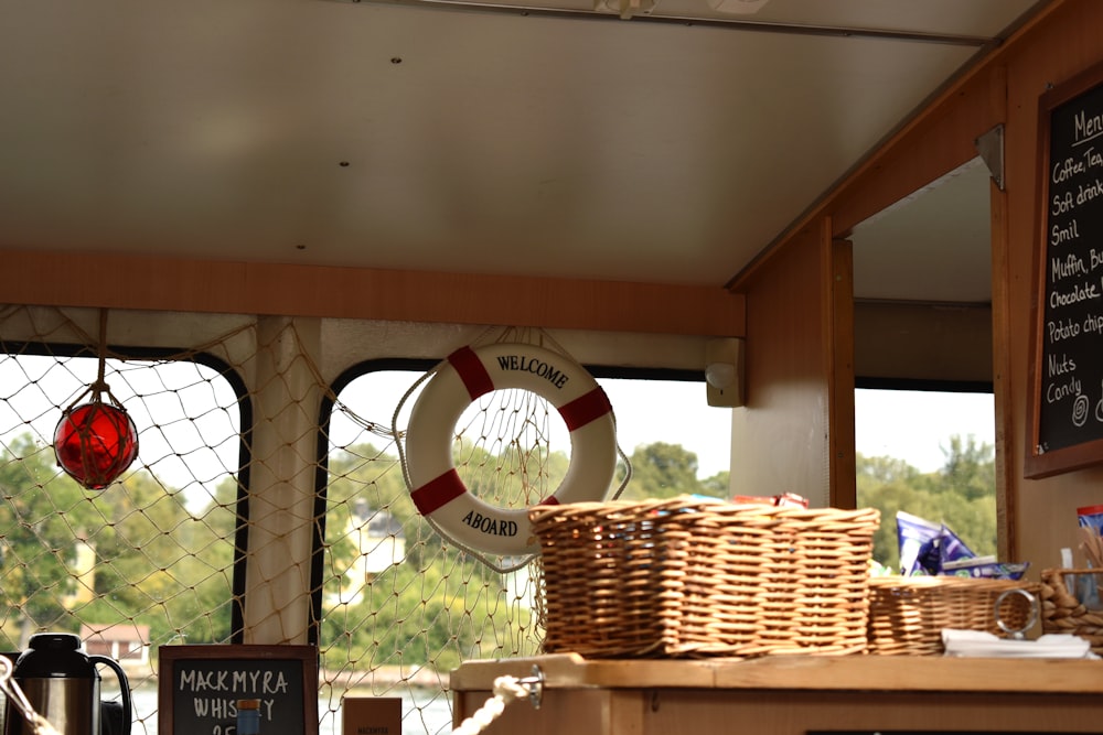 the inside of a boat with a basket on the counter