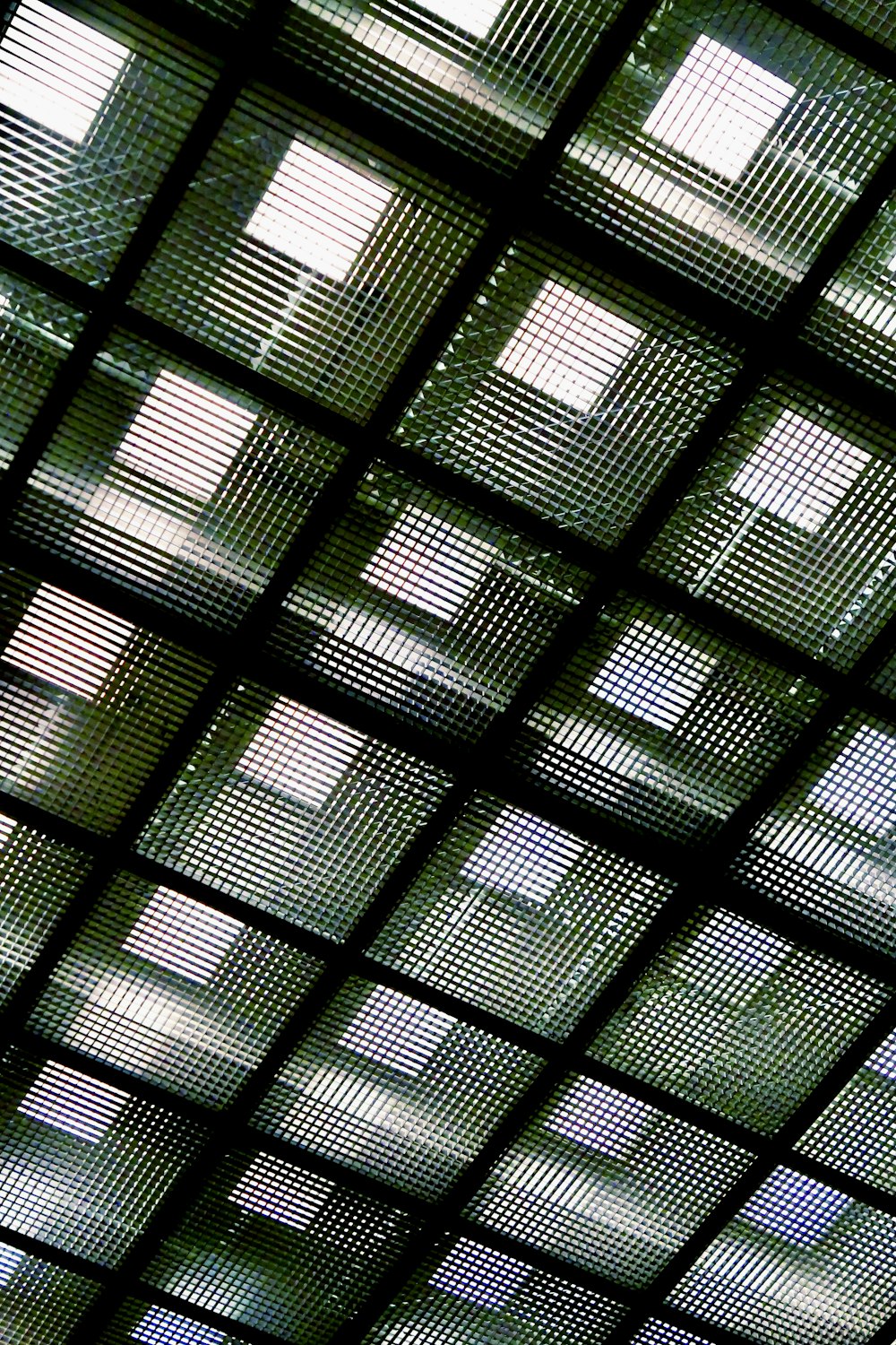 a close up of a ceiling with a clock on it