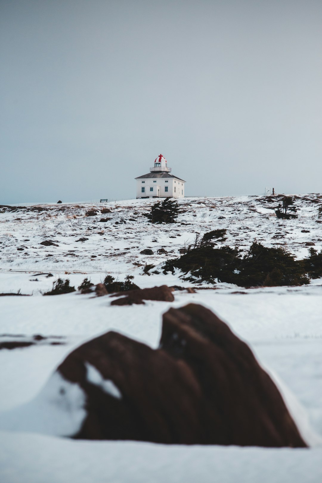 building on snowfield during day