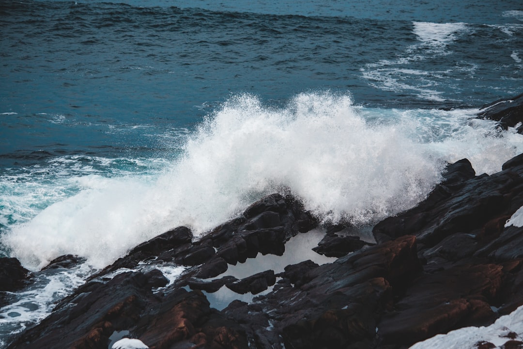 gray rock formations near bi body of water during daytime