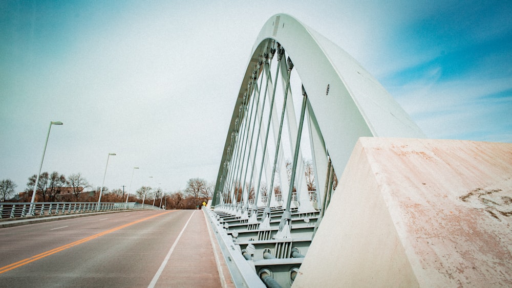 white arc bridge photograph